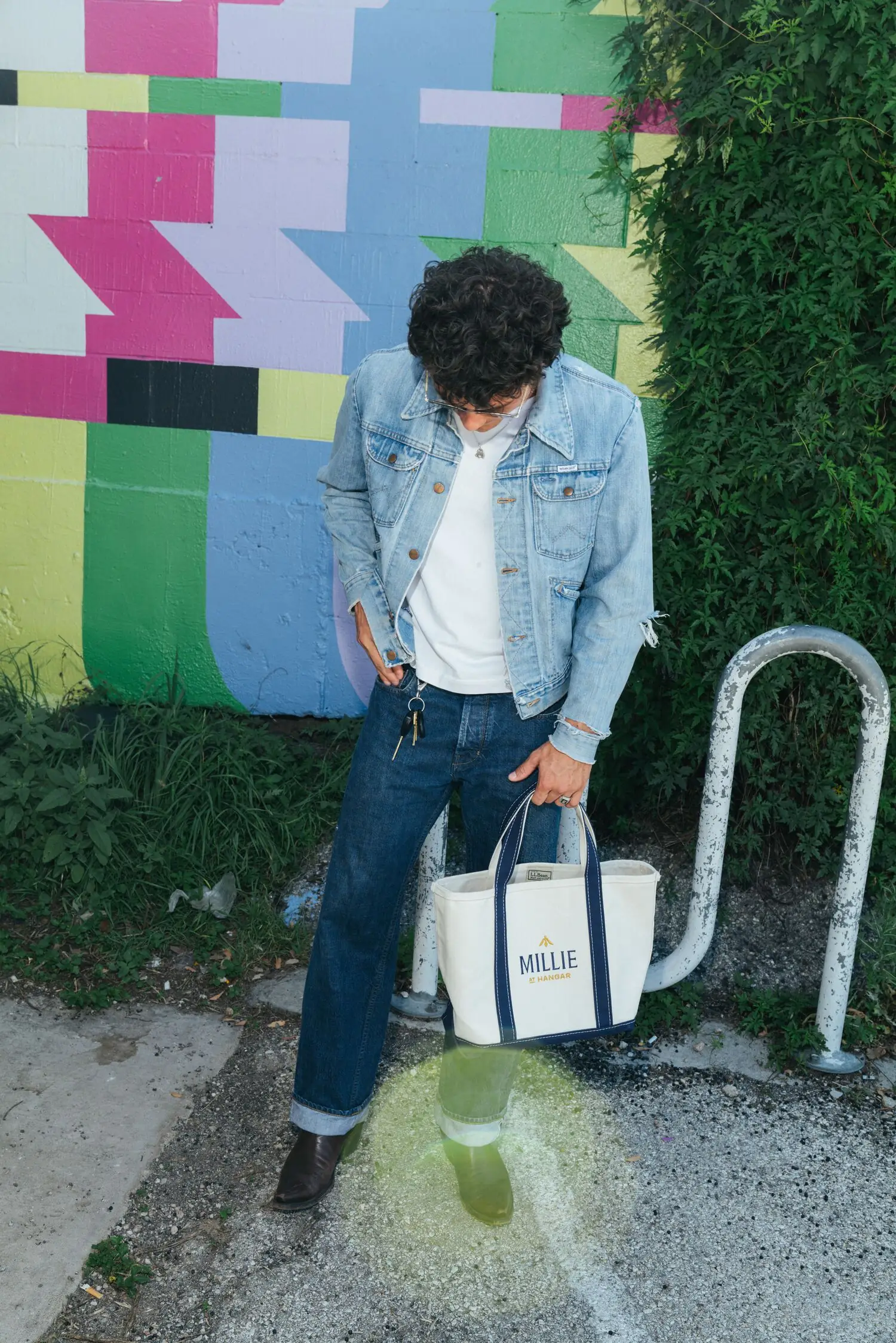 A Millie tote bag resting on a bike rack